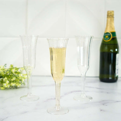 12 - Pack Plastic Champagne Flutes Clear/Gold Glitter Flared Design - Lightweight Disposable Toasting Glasses 6oz - Linen Luxes