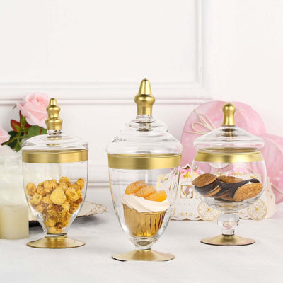 Set of 3 Glass Jars Apothecary Design Clear with Gold Trim and Snap - On Lids - Stylish Decorative Candy Buffet Storage 8.5", 9", 10" - Linen Luxes